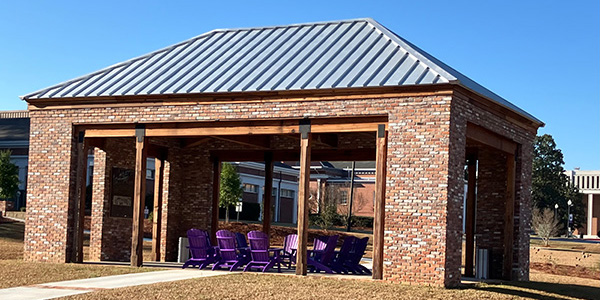 Purple Adirondack chairs placed inside the Barrs Family Learning Pavilion on the Cochran Campus.
